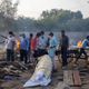 Relatives prepare to cremate the body of a person, who died due to the coronavirus disease (COVID-19), at a crematorium ground in New Delhi